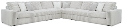 Ashley Furniture Stupendous sectional with plush cushions and neutral fabric, shown in a spacious living room setting.