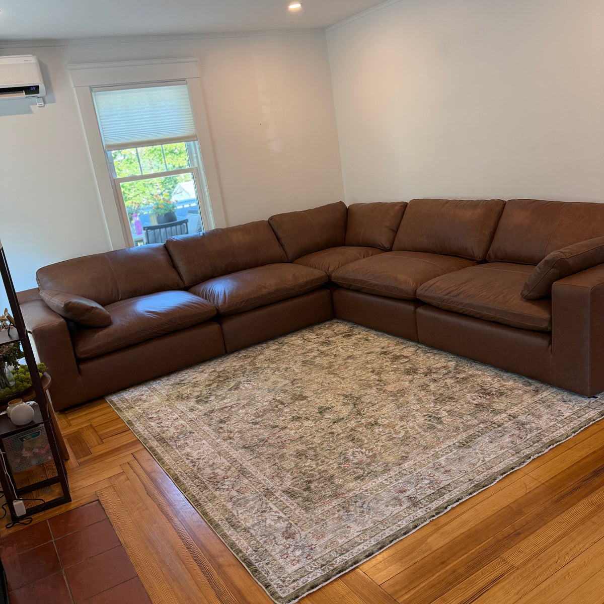 Ashley Furniture Atlas Reserve corner sectional in a cozy living room setting with plush cushions and neutral upholstery.