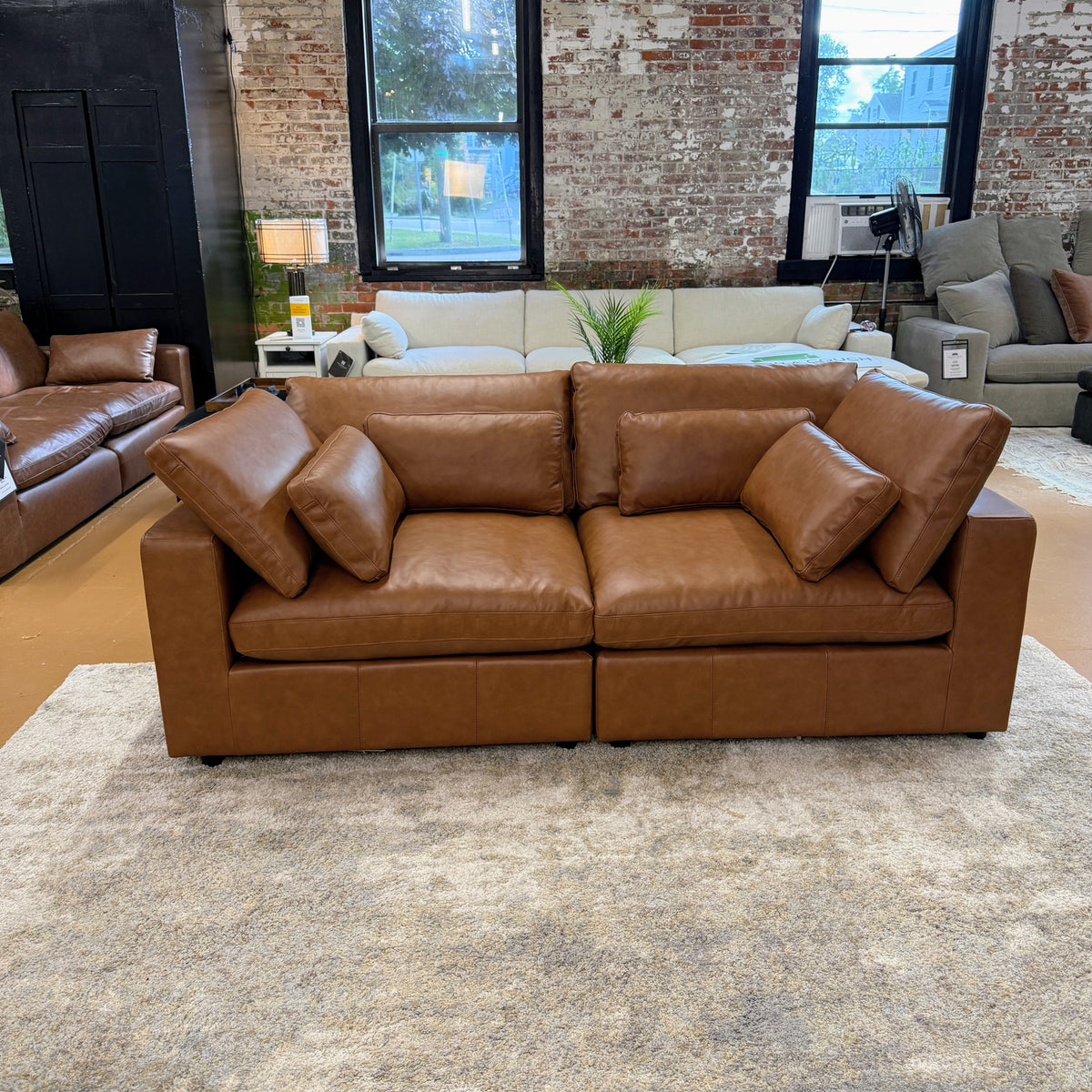Pull Up A Couch Serenity Reserve sectional sofa in neutral fabric, showcasing plush cushions and modern design in a living room setting.