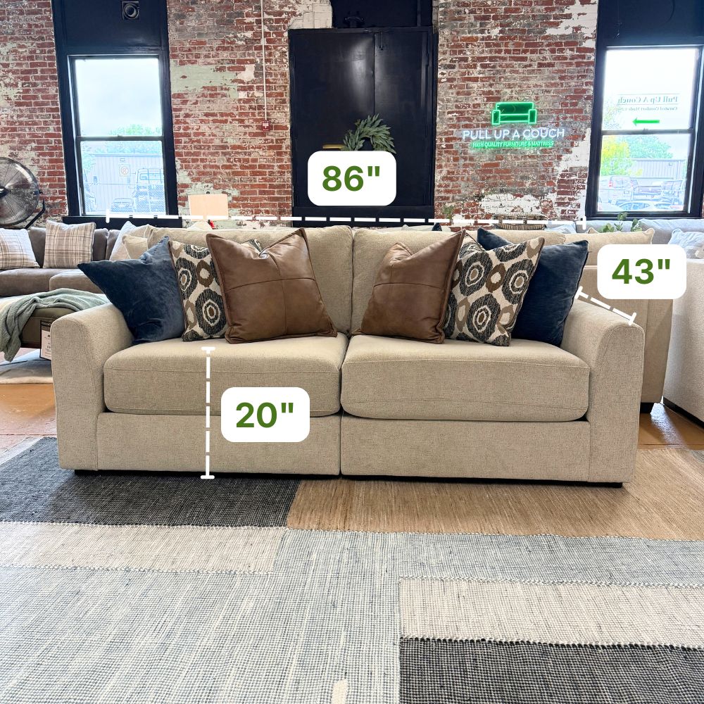 Behold Home Sequoia Sectional Sofa in neutral fabric with plush cushions and modern design, shown in a stylish living room setting.