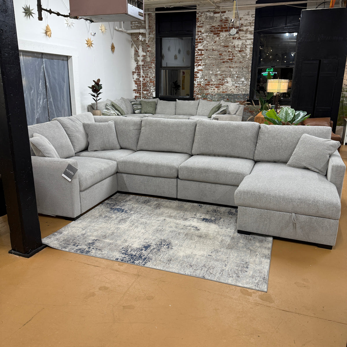 Ashley Furniture Haven 5-piece modular sectional with chaise, showing plush fabric cushions and modern design in a living room setting.
