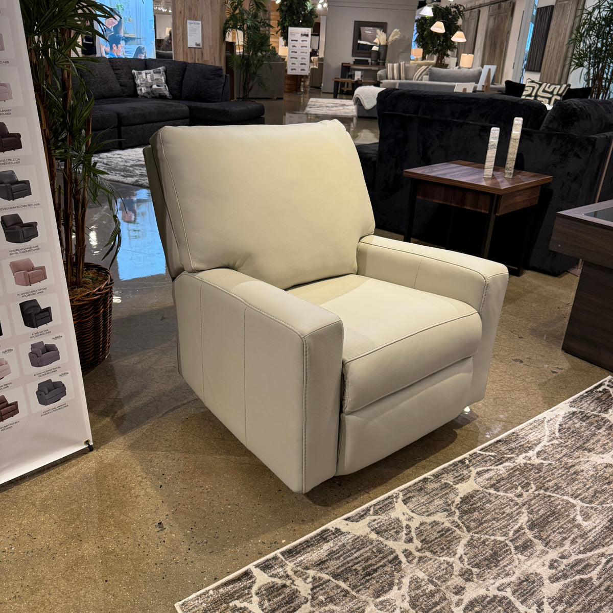 Ashley Furniture Torino manual rocker recliner chair with plush cushioning and wooden base, shown in a cozy living room setting.