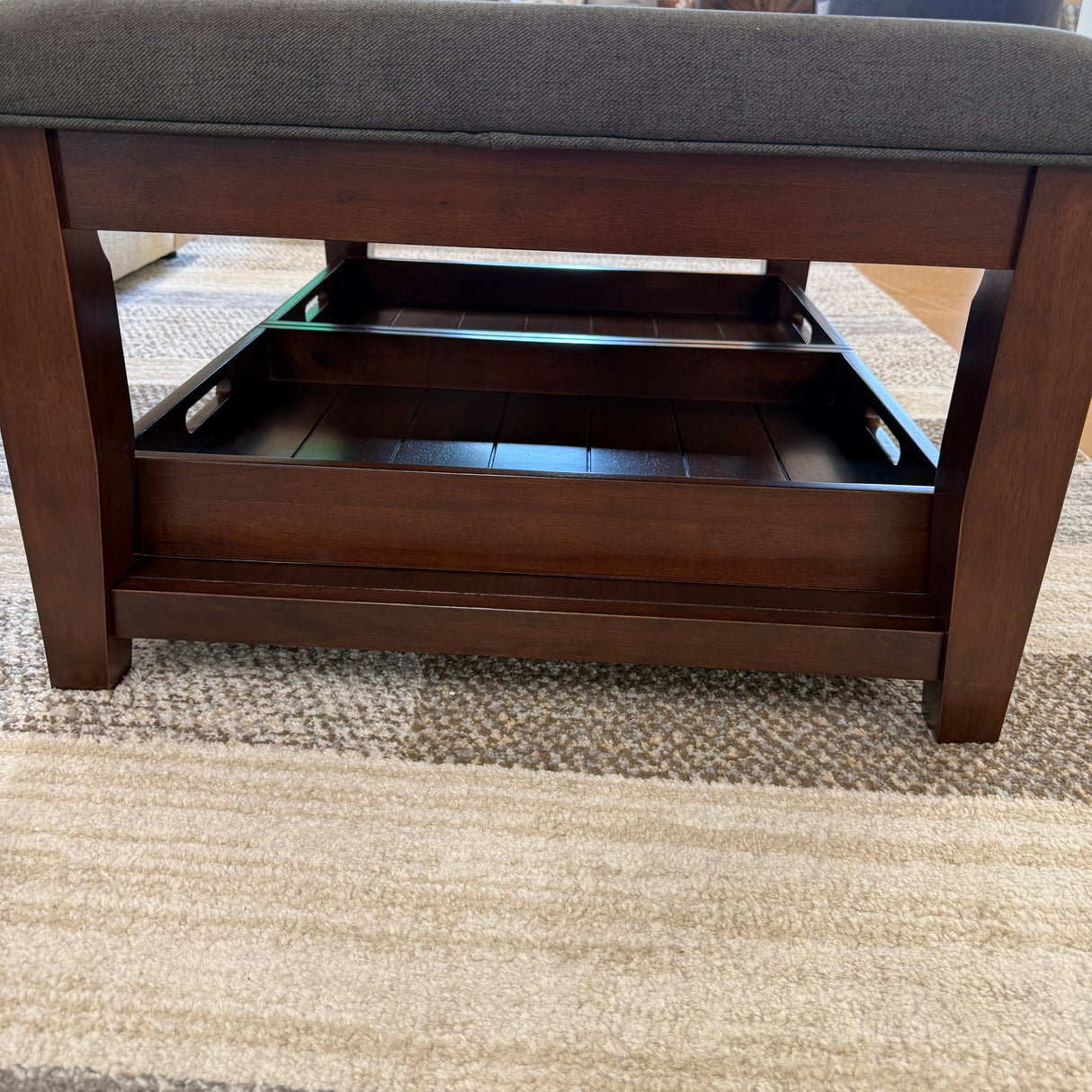 Pull Up A Couch Roseville ottoman coffee table with wooden legs and a round top, ideal for living room decor.