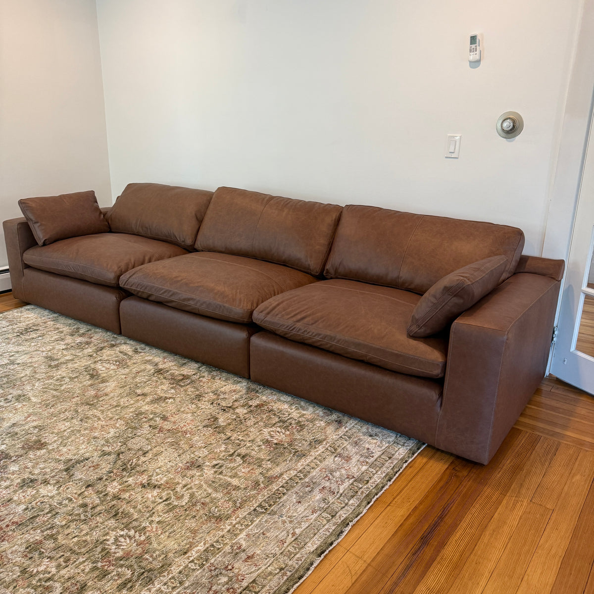 Ashley Furniture Atlas Reserve Modular Sofa set with three sections, featuring plush cushions and modern design in a stylish living room setting.