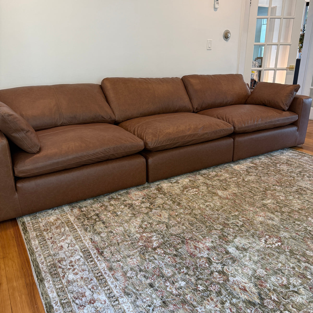 Ashley Furniture Atlas Reserve Modular Sofa, three-piece sectional with plush cushions and modern design, in a neutral fabric.