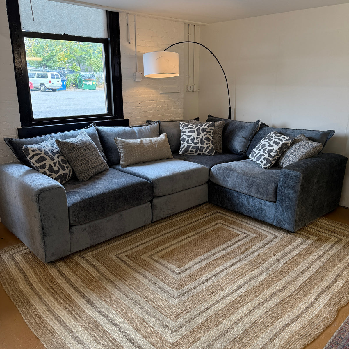 Fusion Barrington 4-piece corner sectional sofa with plush cushions and modern design, shown in a living room setting.