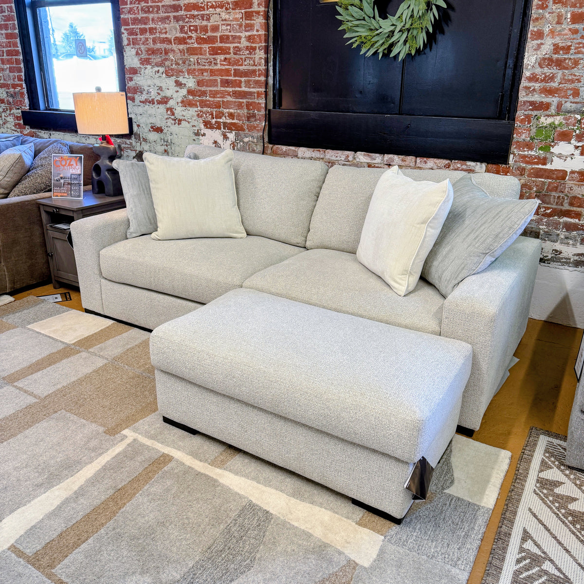Ashley Furniture Hudson Sofa, stylish and comfortable sofa with plush cushions and modern design, showcased in a living room setting.