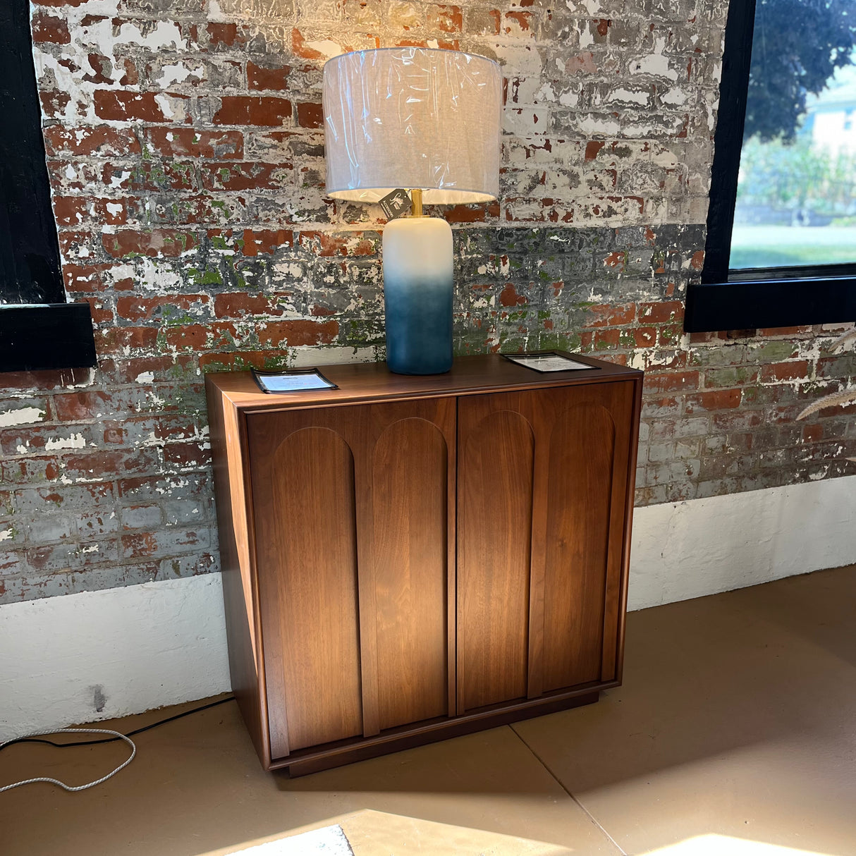 Modern 37-inch walnut MCM cabinet with storage space, designed by Article, featuring sleek wood finish and minimalist style.