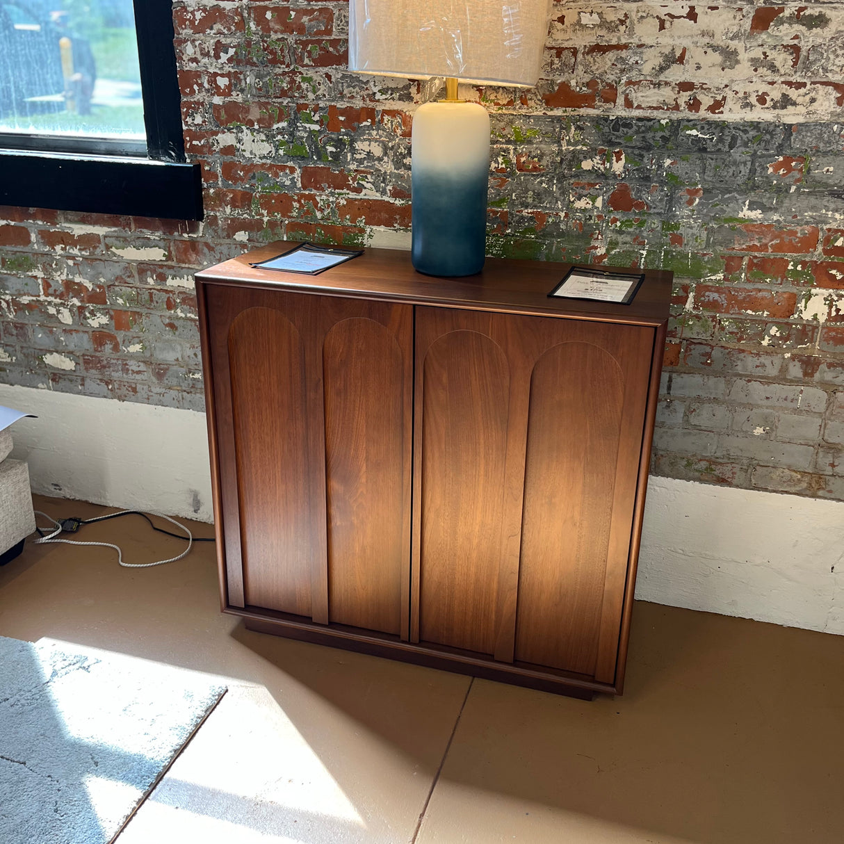 Elegant 37-inch walnut MCM-style storage cabinet by Article, featuring sleek wood finish and modern design.