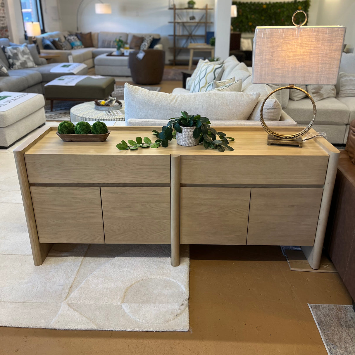 White oak 70-inch MCM-style sideboard by Article with sleek modern design, featuring storage drawers and cabinet doors.