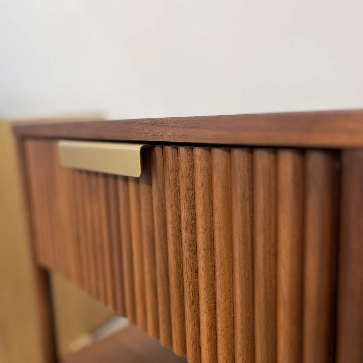 Article MCM-style nightstand with storage in walnut wood, featuring clean lines and modern design for bedroom organization.