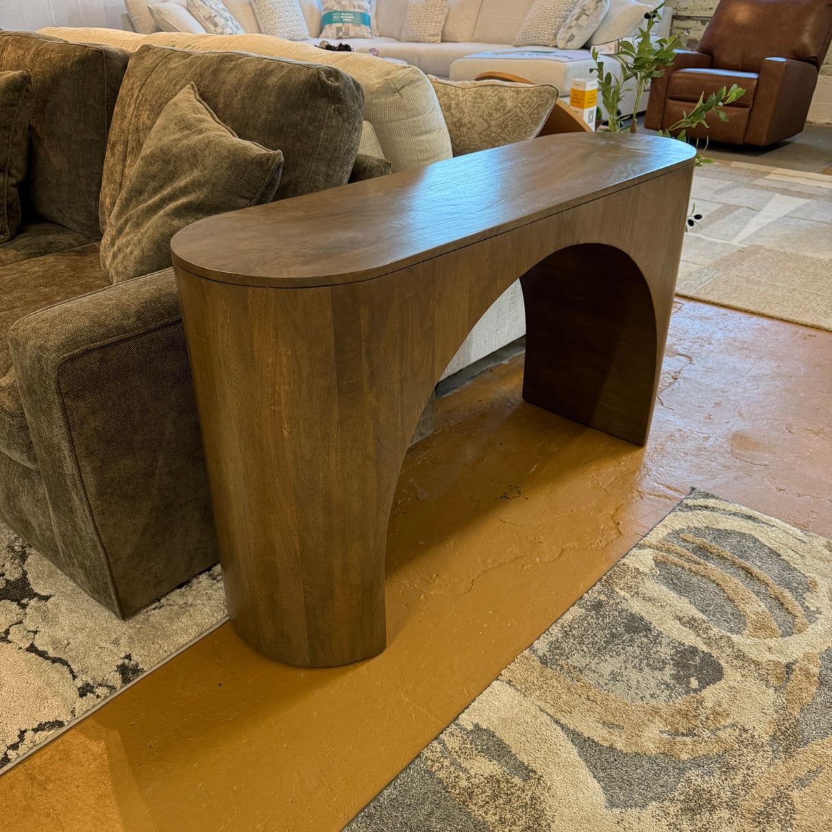 Pull Up A Couch Hayes sofa table with wooden surface and metal legs, placed in a living room setting.