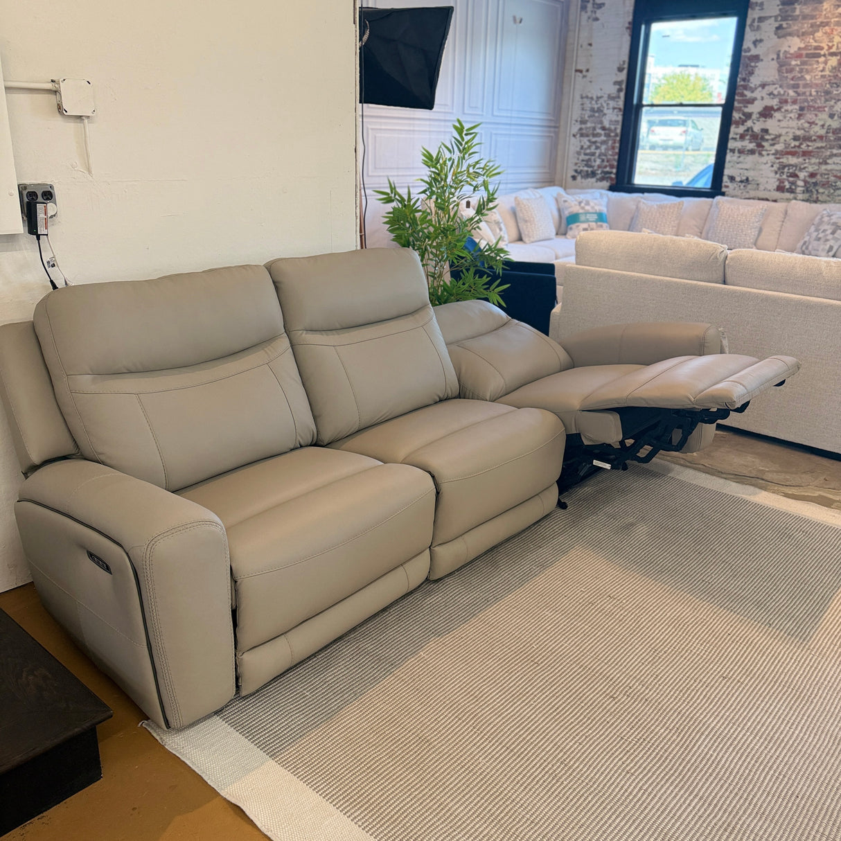 Salerno Power Reclining Sofa by Ashley Furniture, a three-piece living room sofa with plush cushions and reclining features.