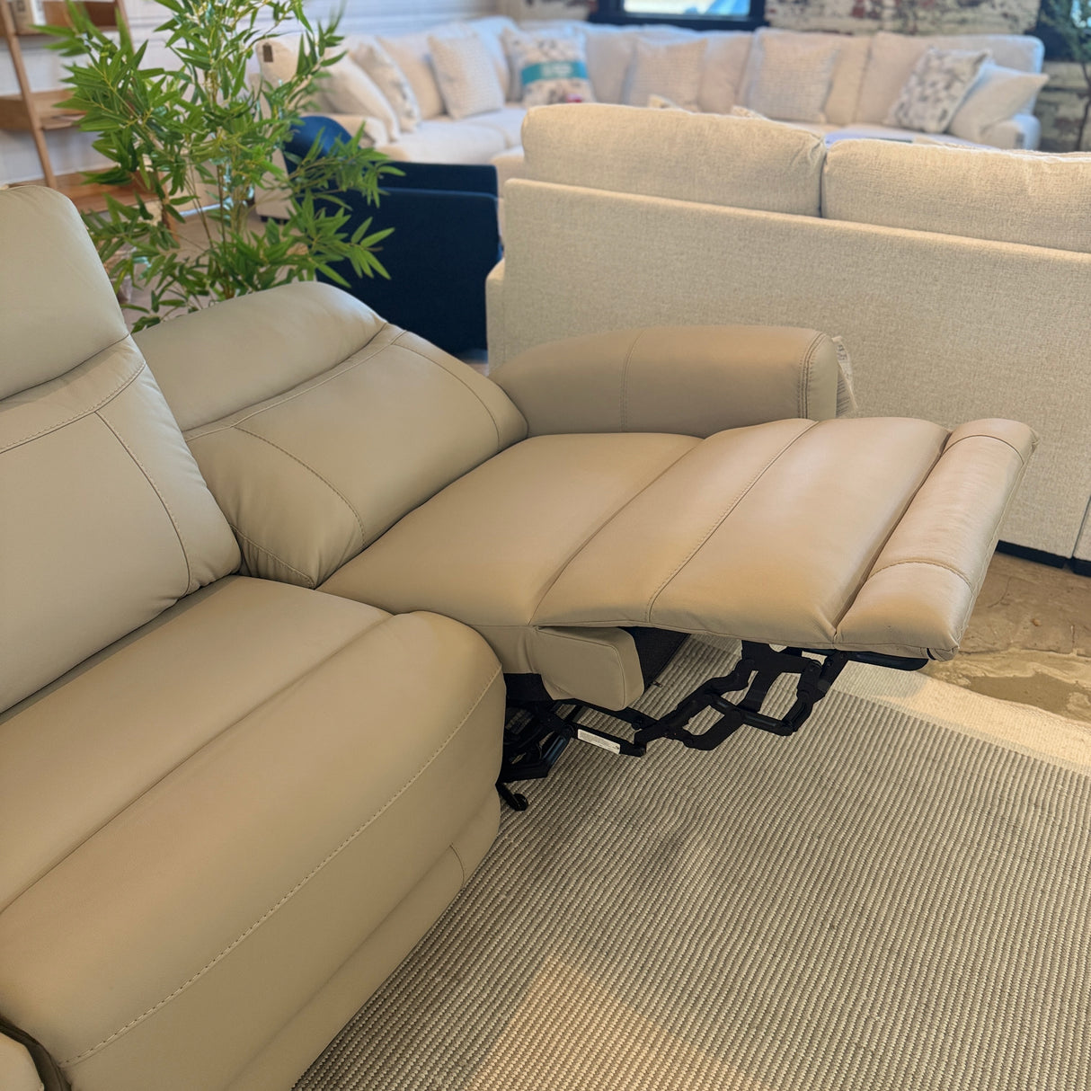 Ashley Furniture Salerno Power Reclining Sofa set with plush cushions and reclining features, shown in a modern living room setting.