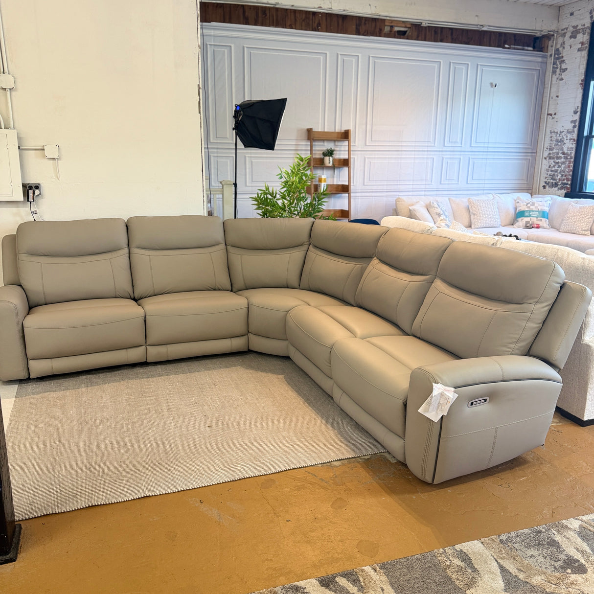 Ashley Furniture Salerno power reclining sectional, 5-piece, with plush cushions and modern design, shown in a stylish living room setting.