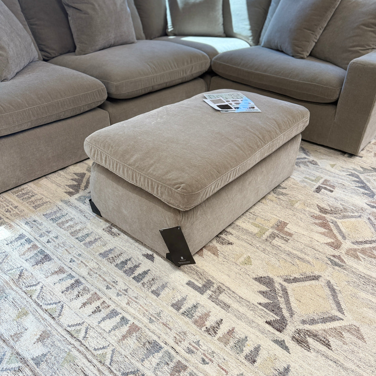 Ashley Furniture Nova Cloud 4-piece corner sectional with plush fabric, featuring multiple seating sections and a modern design.