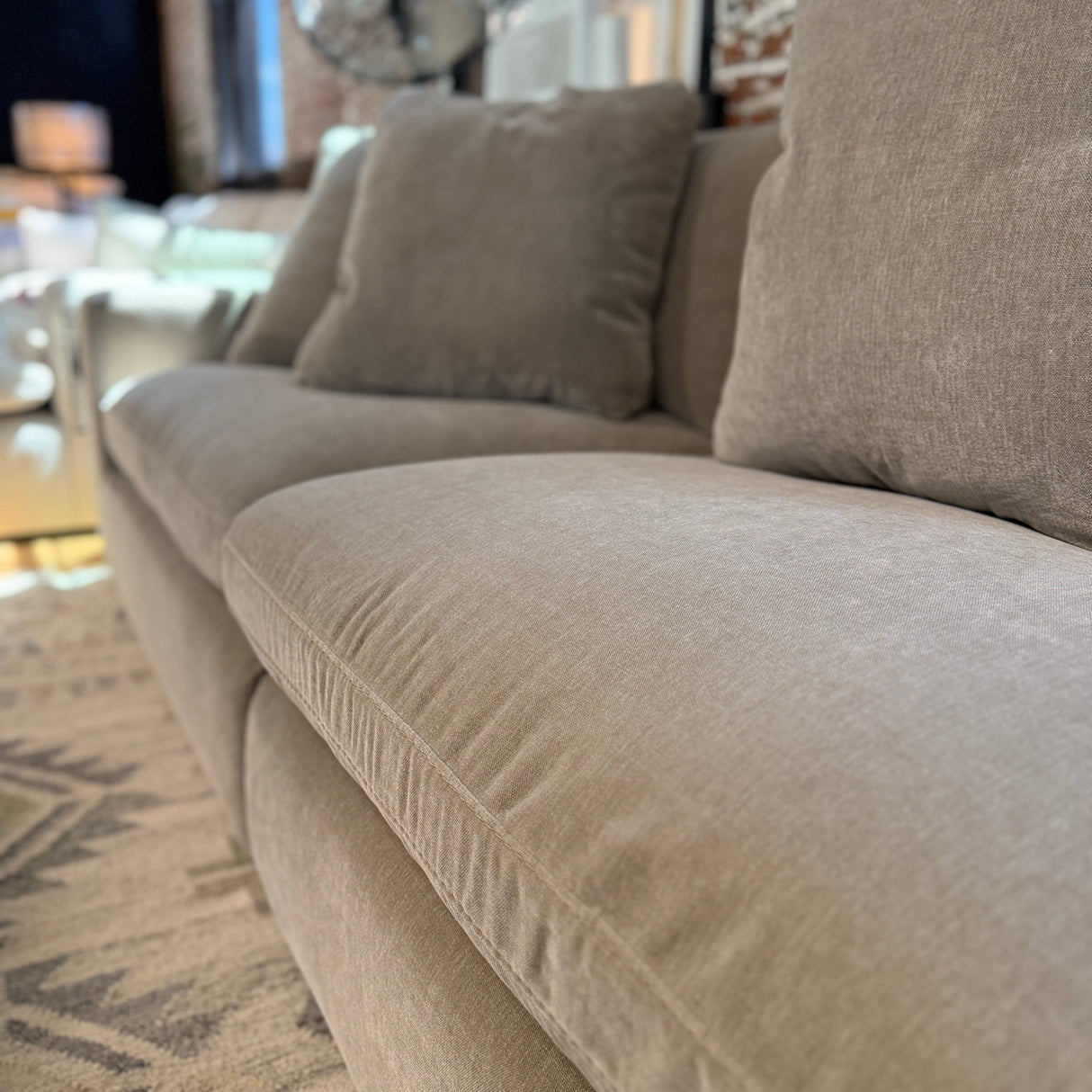 Ashley Furniture Nova Cloud 4-piece corner sectional sofa with plush cushions and contemporary design, shown in a modern living room setting.