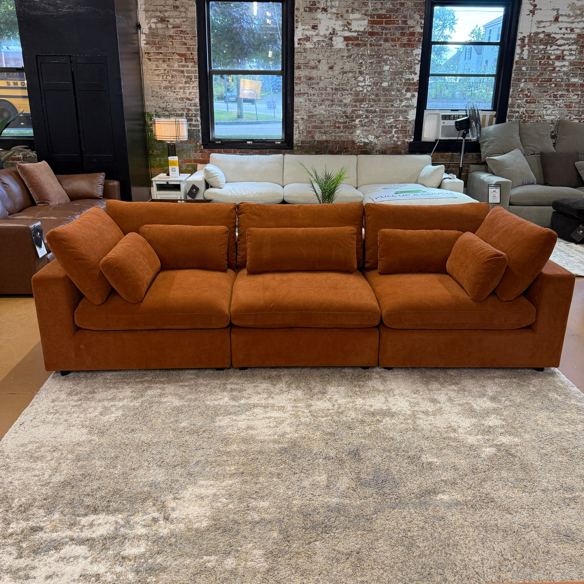Pull Up A Couch Serenity Cloud sectional sofa, three-piece modern sectional with plush cushions in a cozy living room setting.