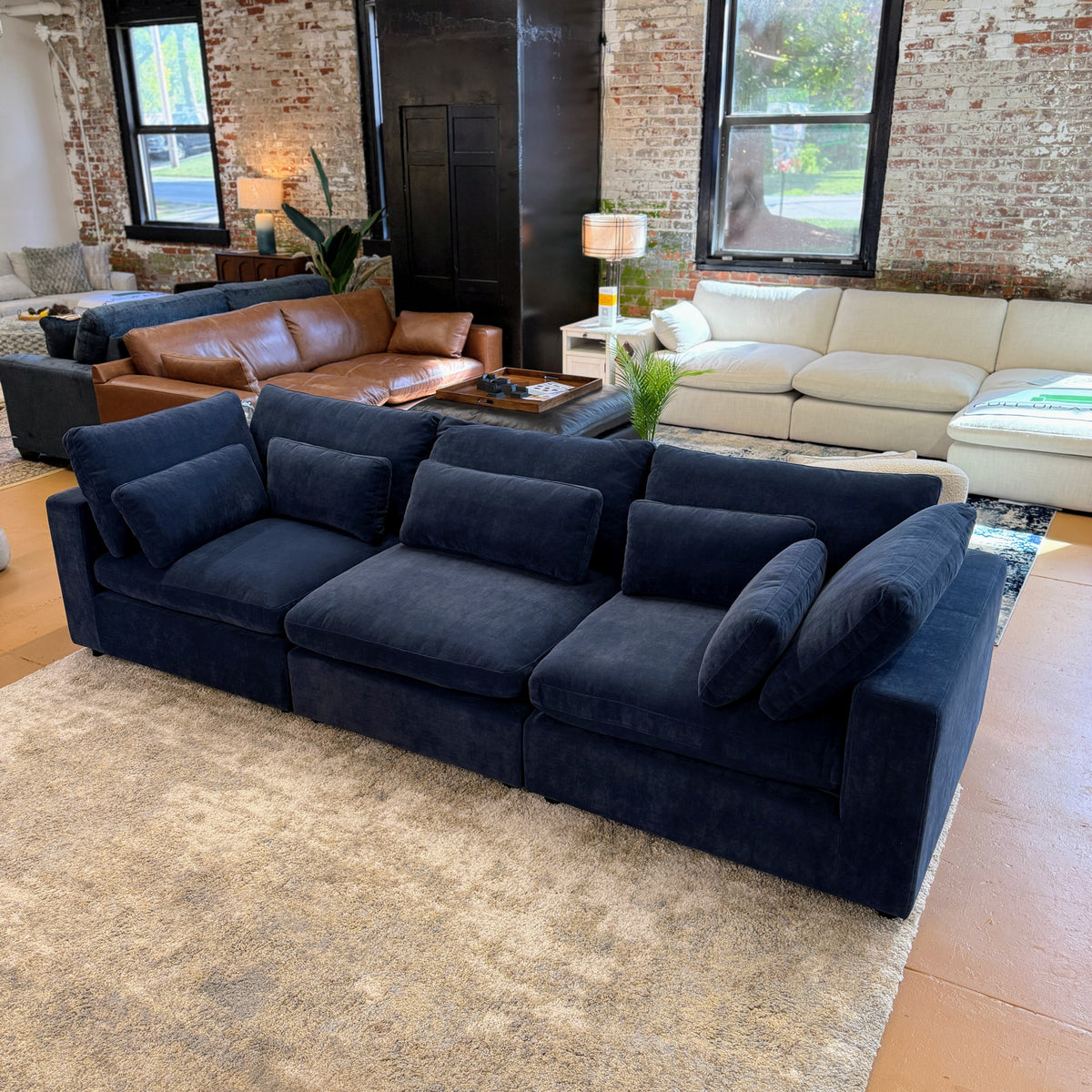 Pull Up A Couch Serenity Cloud sectional sofa in a three-piece arrangement, featuring soft fabric cushions and modern design.