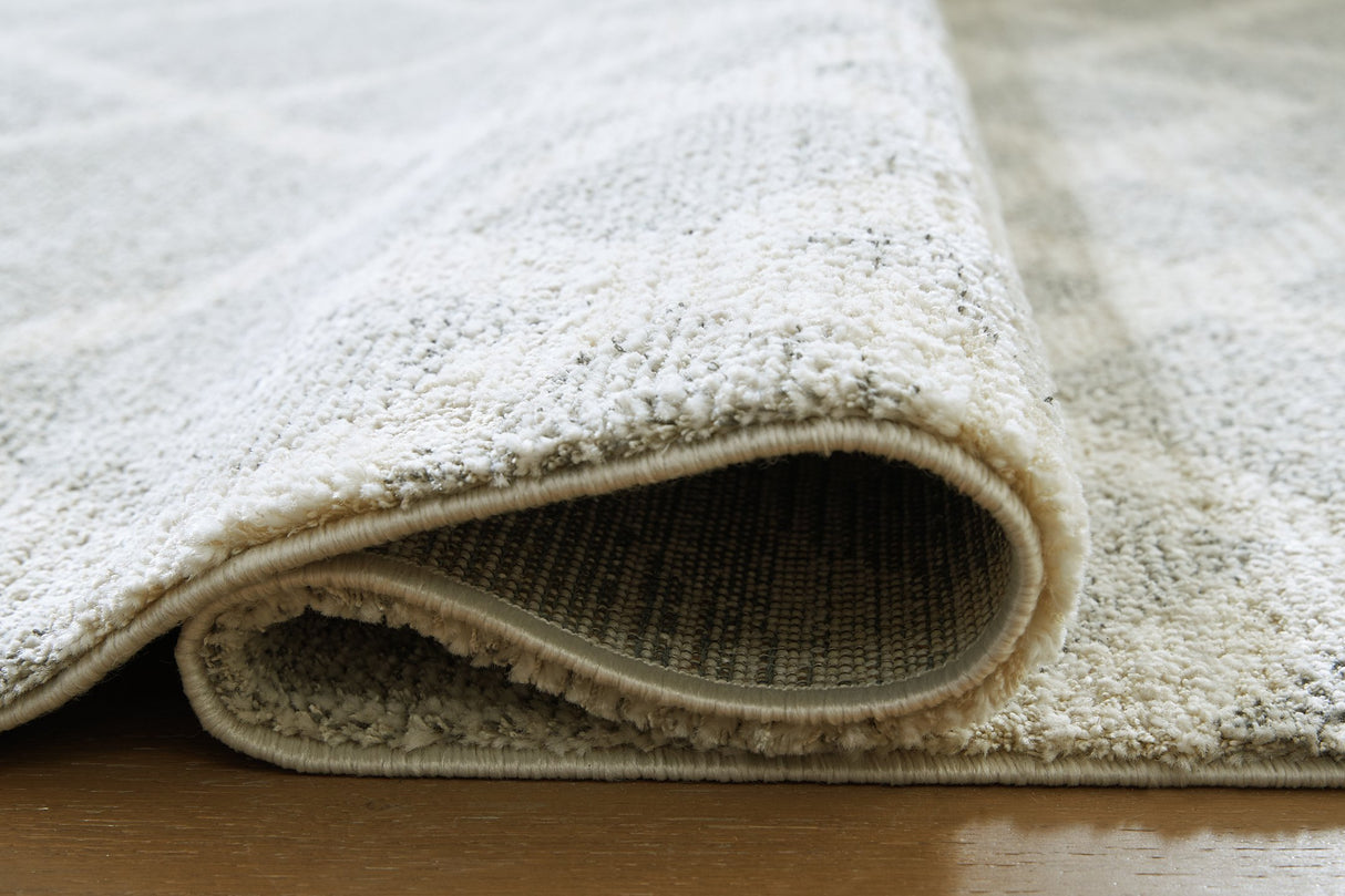 Unawick Large Rug - Pull Up A Couch