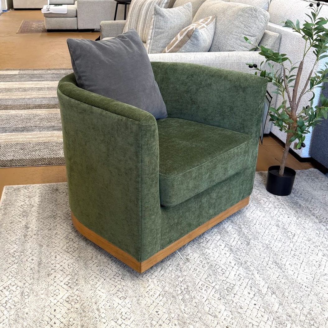 Ashley Furniture Jersonlow swivel chair with cushioned seat and backrest, featuring a modern design and armrests.