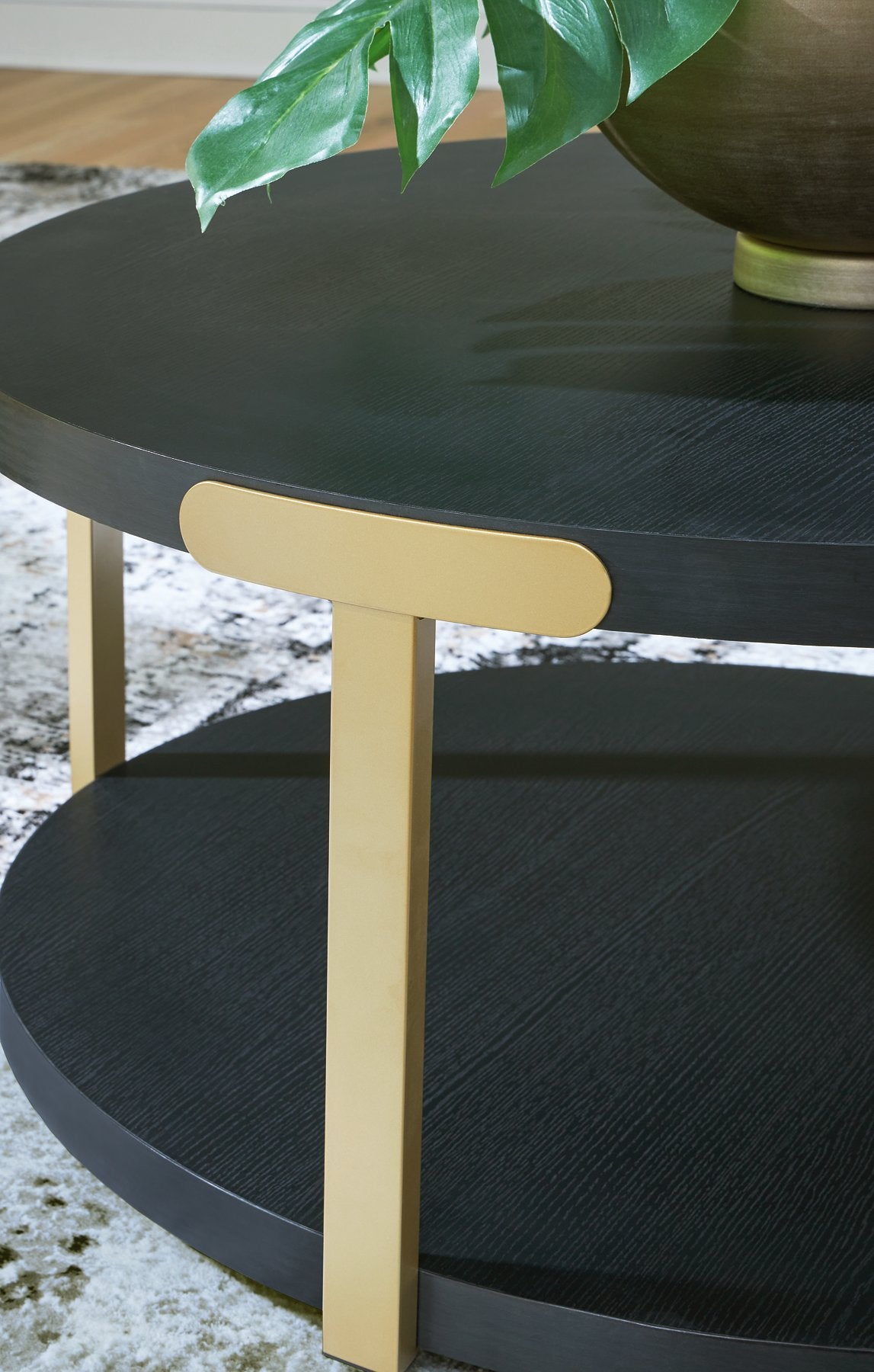 Set of three Ashley Furniture Shylore tables, featuring modern wooden tabletops and sleek metal legs, detailed close-up.