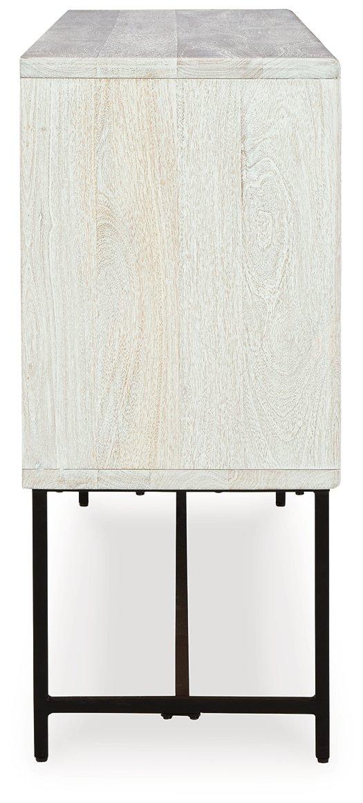 Ashley Furniture Freyton Accent Cabinet with wood finish, featuring storage drawers and decorative hardware in a stylish home decor setting.