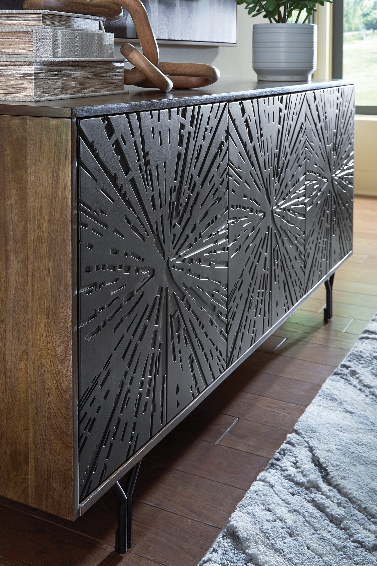 Ashley Furniture Lavinmont accent cabinet with a sleek wood finish and modern design, featuring storage compartments and decorative accents.