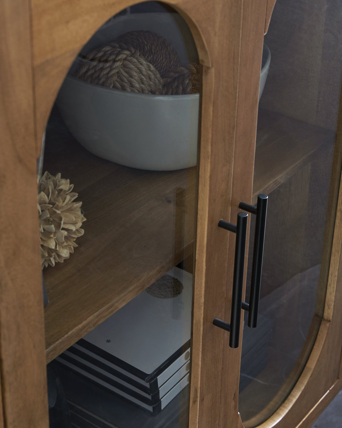 Ashley Furniture Niall Accent Cabinet featuring sleek wood finish and modern design with storage drawers.