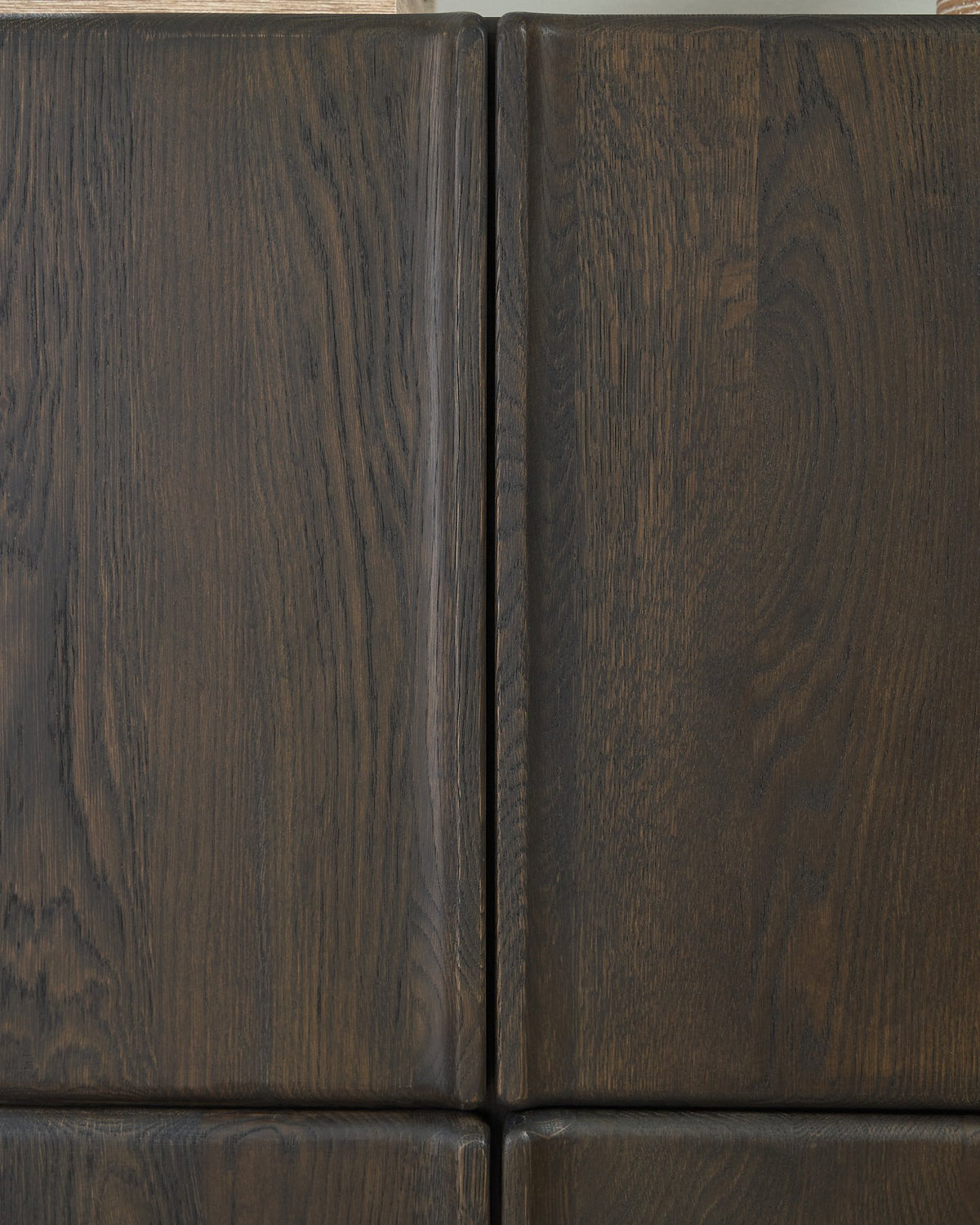 Ashley Furniture Orsonal Accent Cabinet with sleek wood finish and modern design, featuring storage drawers and decorative detailing.