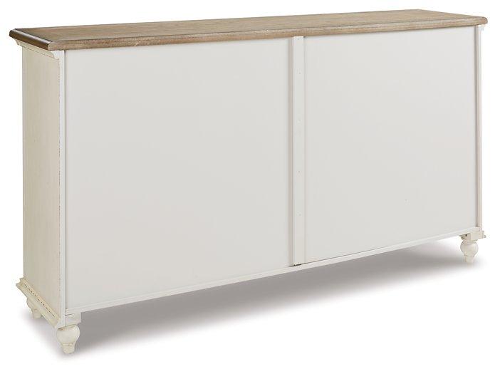 Ashley Furniture Roranville accent cabinet with wood finish and decorative hardware, ideal for stylish storage in living rooms.