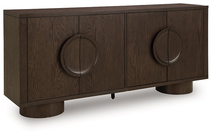 Ashley Furniture Veeda Accent Cabinet with closed doors, featuring a sleek design and wooden finish, shown from an angled perspective.