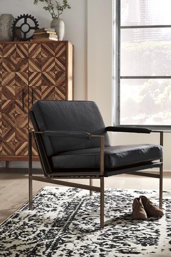 Ashley Furniture Puckman Accent Chair with plush fabric upholstery and modern design, shown in a stylish living room setting.