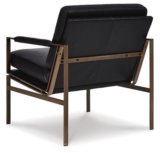 Ashley Furniture Puckman Accent Chair featuring plush fabric and modern design, perfect for stylish living room seating.