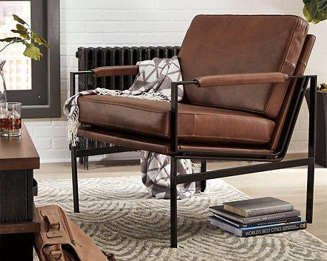 Ashley Furniture Puckman Accent Chair with modern design and plush upholstery, perfect for living room or bedroom decor.