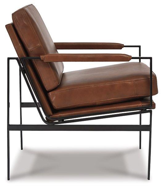 Ashley Furniture Puckman Accent Chair with plush fabric and modern design, showcasing a stylish, comfortable seating option.