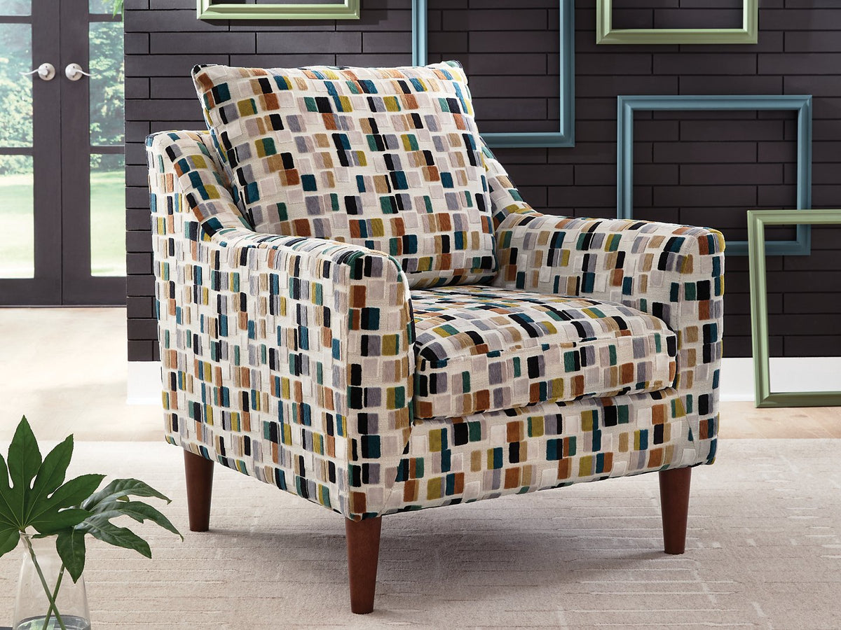 Ashley Furniture Fenna accent chair with plush beige upholstery and stylish wooden legs, shown in a modern living room setting.