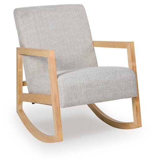 Ashley Furniture Wychworth accent chair with plush beige upholstery and wooden legs, shown from an angle.
