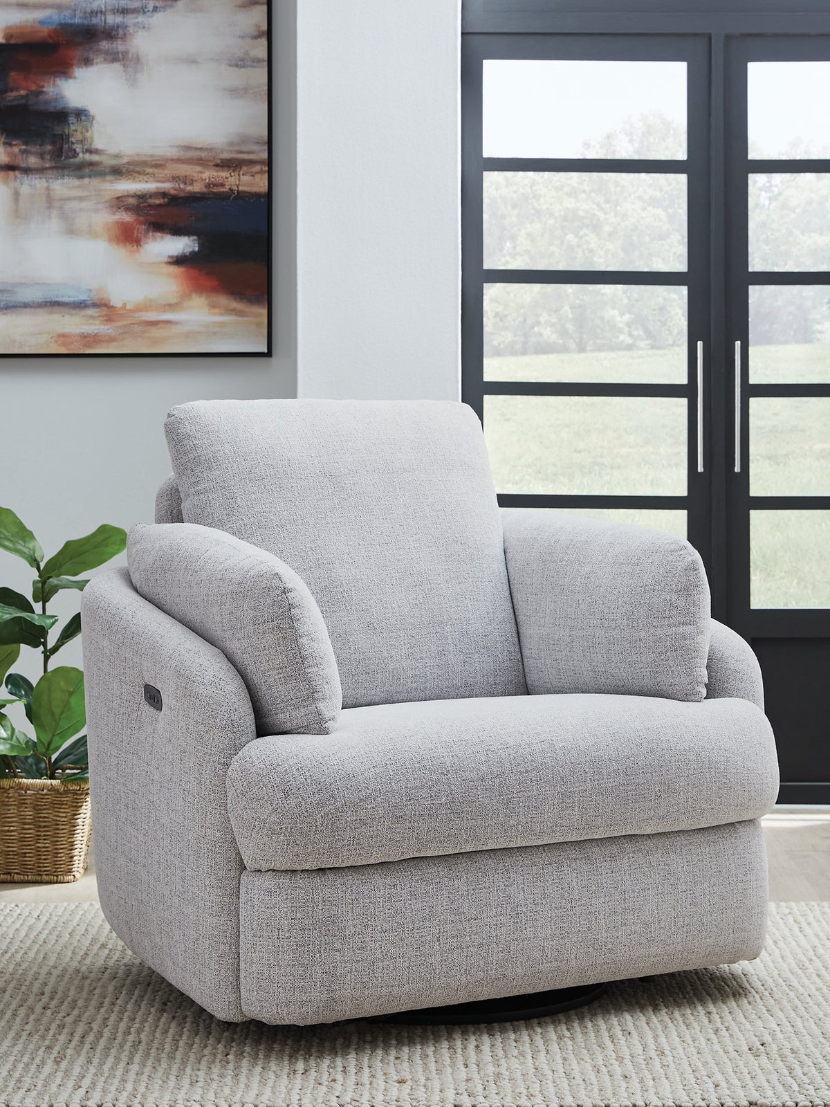 Ashley Furniture Alainmont Next-Gen Nuvella swivel power recliner accent chair with plush cushioning and modern design.