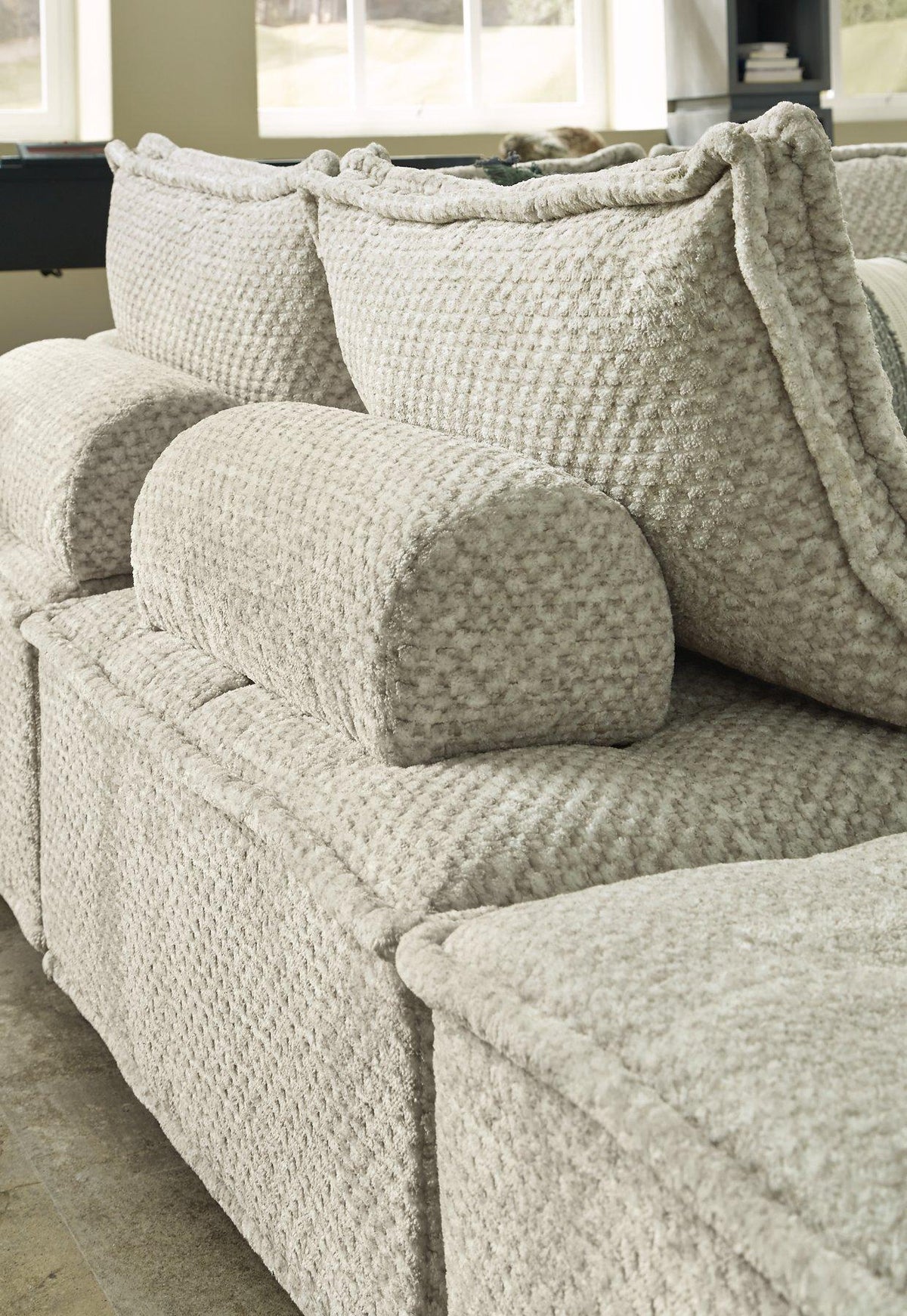 Ashley Furniture Bales accent chair with plush fabric upholstery and modern design, shown in a stylish living room setting.