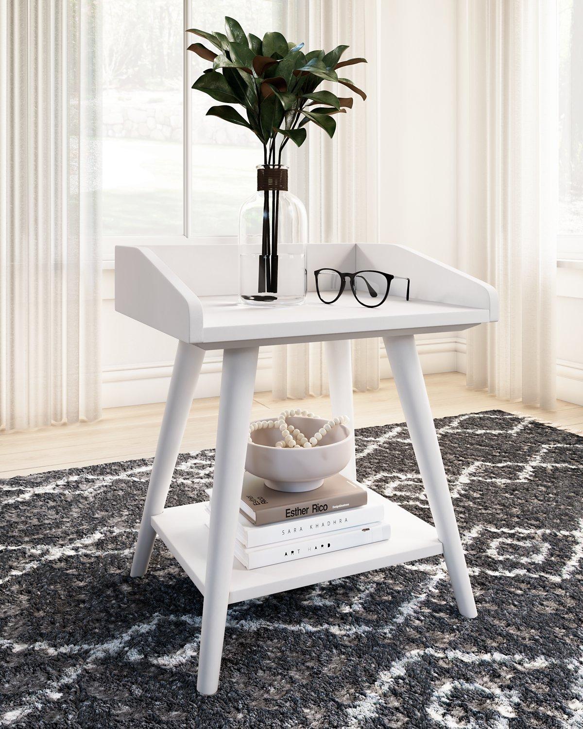 Ashley Furniture Blariden accent table with a sleek wooden top and metal legs, perfect for living room decoration.