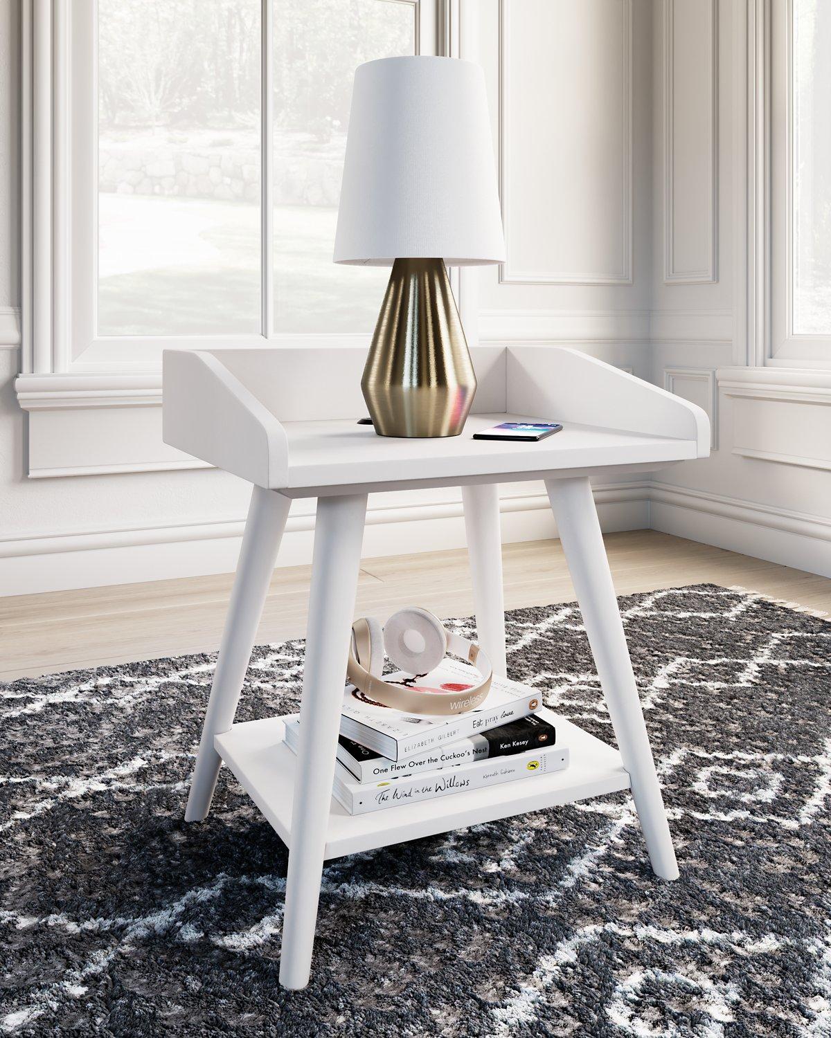 Ashley Furniture Blariden accent table with a sleek wooden surface and modern design, ideal for living room or bedroom decor.