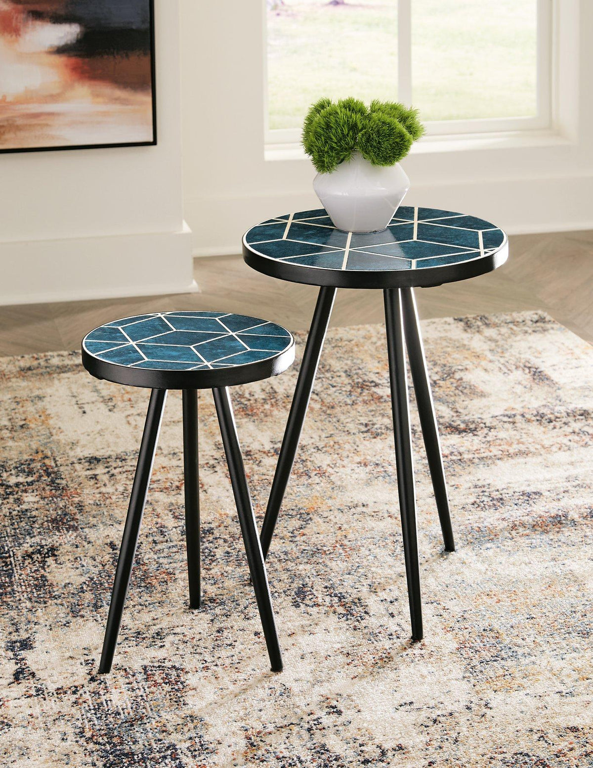 Set of two Ashley Furniture Clairbelle accent tables with wooden tops and tapered legs, ideal for living room decor.