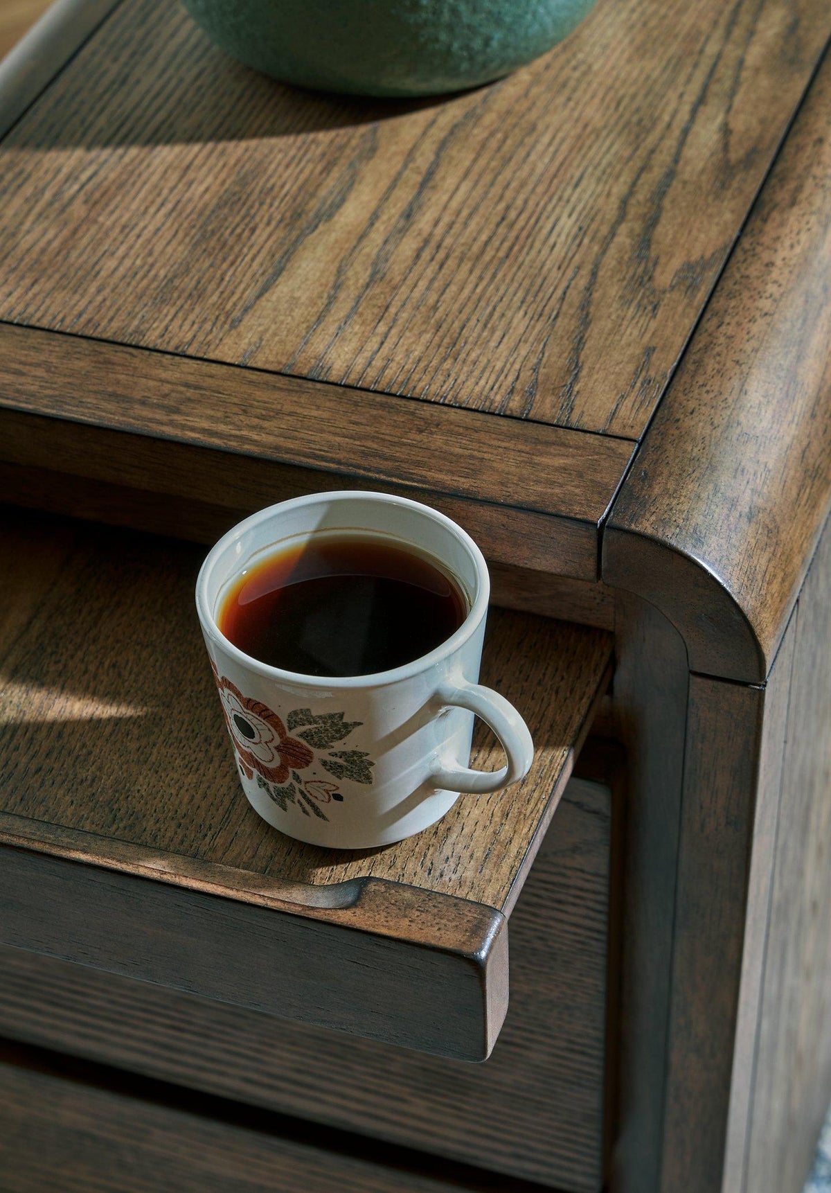 Ashley Furniture Jensworth accent table with wooden top and metal legs, stylish and modern interior decor piece.
