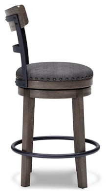 Ashley Furniture Caitbrook counter height bar stool with wooden frame and upholstered seat, shown from the side in a modern kitchen setting.