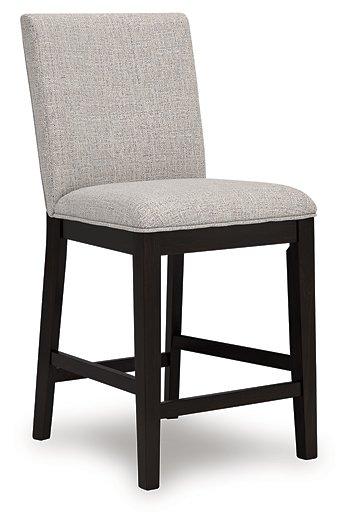 Neymorton counter height barstool by Ashley Furniture with upholstered seat and wooden legs, ideal for kitchen or bar area.
