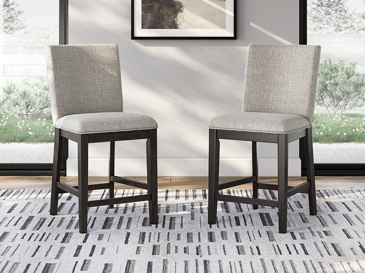 Ashley Furniture Neymorton counter height barstool with wooden legs and upholstered seat, shown from a front angle.