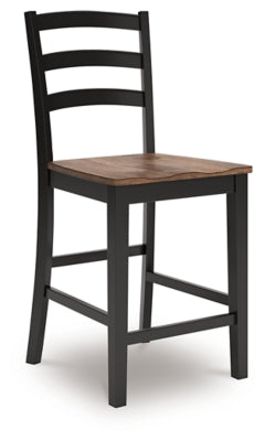 Ashley Furniture Wildenauer counter height barstool with wooden legs and upholstered seat, shown from an angled side view.