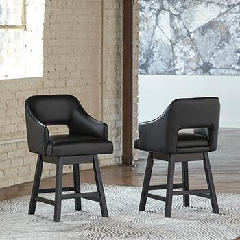 Tallenger counter height bar stool by Ashley Furniture with wooden legs and cushioned seat, ideal for kitchen or bar area.