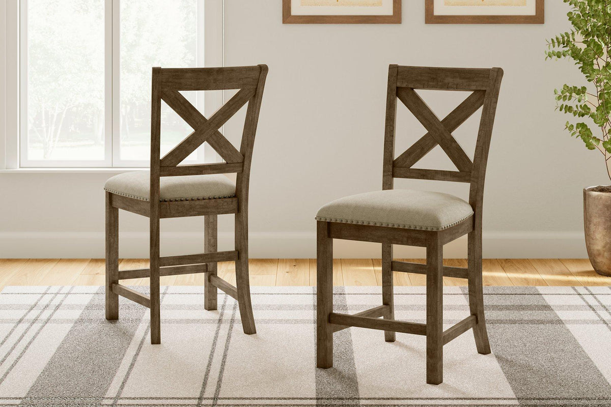 Set of Ashley Furniture Moriville barstools with wooden seats and metal legs, ideal for kitchen or bar area.